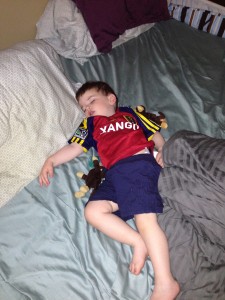 Usually he watches games the same way I prefer to: in his jersey, in bed, with his eyes closed.